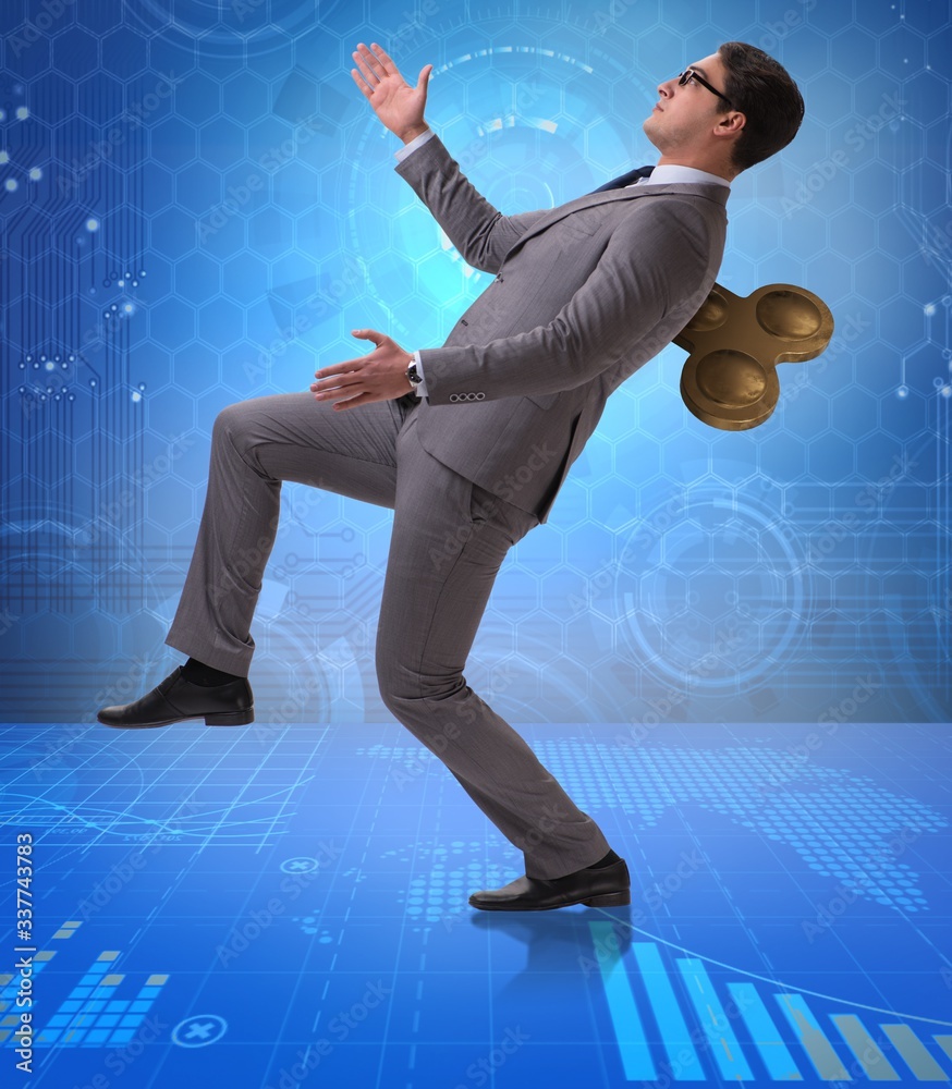 Businessman with key in hardworking concept