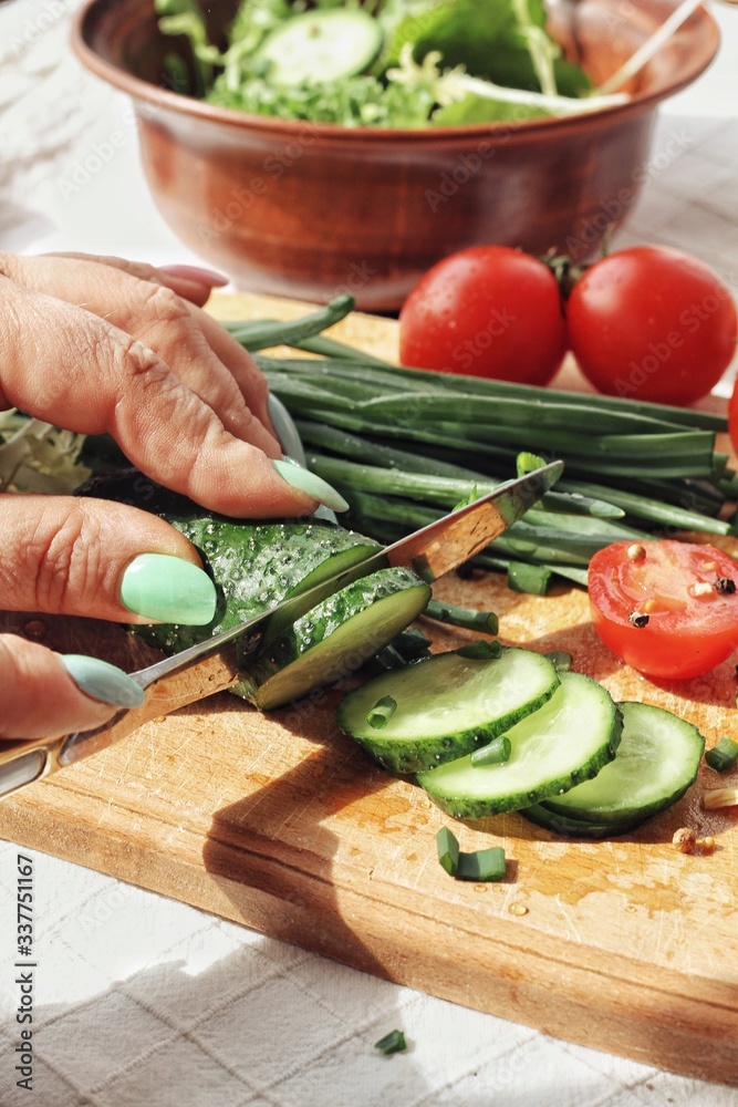 Dietary food background: vegetable salad with cherry tomatoes and cucumbers, vegan cuisine