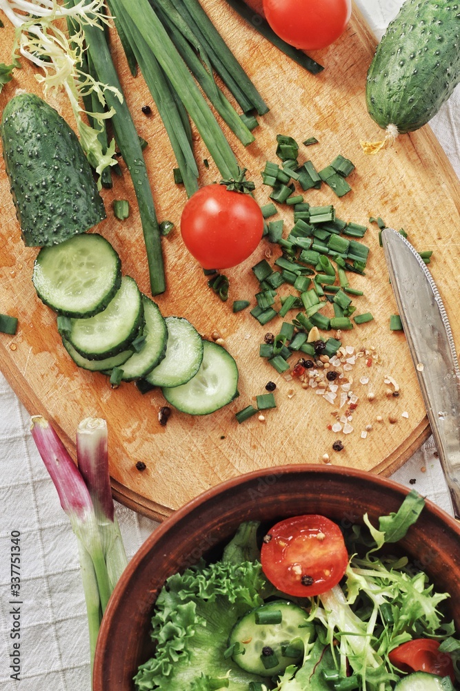 Dietary food background: vegetable salad with cherry tomatoes and cucumbers, vegan cuisine