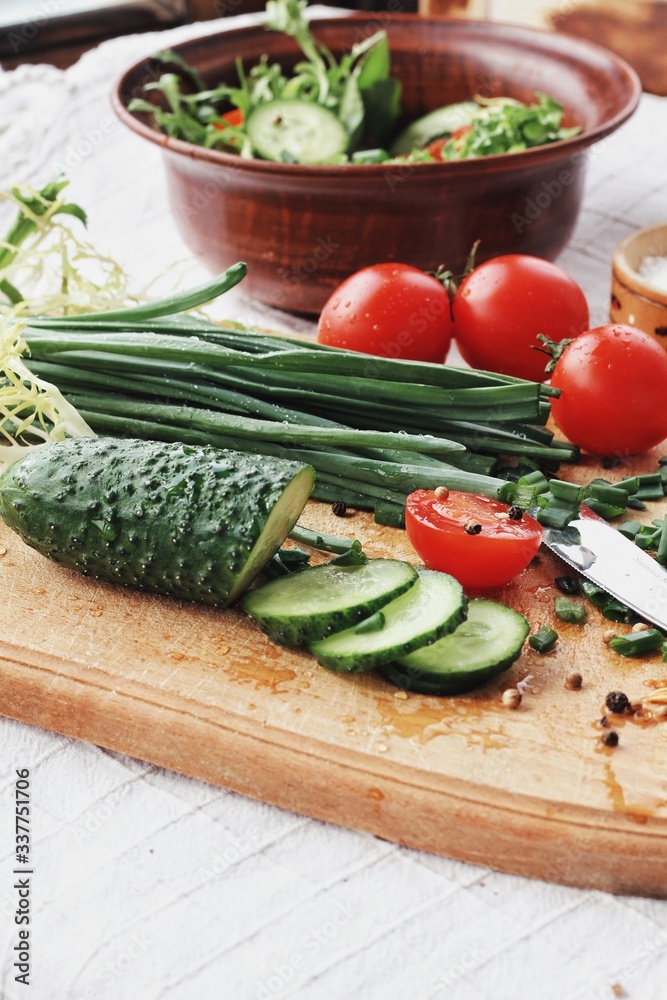 Dietary food background: vegetable salad with cherry tomatoes and cucumbers, vegan cuisine