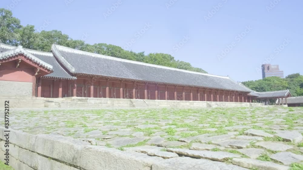 Camera track left corner view along empty courtyard of Confucian Jongmyo Shrine angled in Seoul, South Korea Camera track left corner view along empty courtyard of Confucian Jongmyo Shrine angled in Seoul, South Korea
