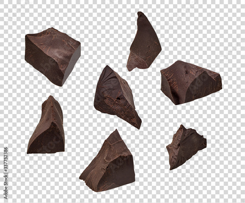 Cracked chocolates / broken chocolate chips or chocolate parts top view on isolated background including clipping path photo