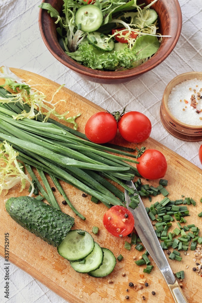 Dietary food background: vegetable salad with cherry tomatoes and cucumbers, vegan cuisine
