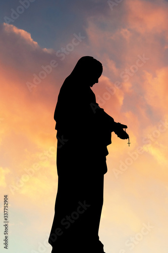 illustration of Virgin Mary at sunset