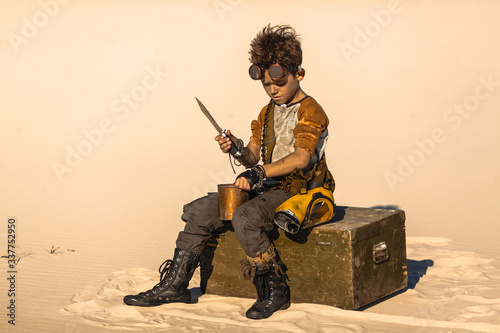 Fototapeta Post-apocalyptic Warrior Boy Outdoors in Desert Wasteland