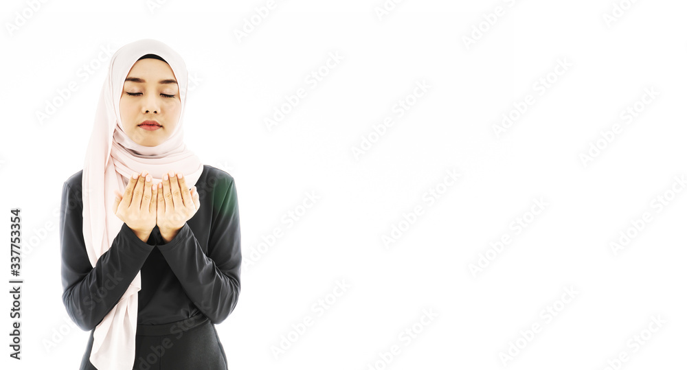 Portrait of beautiful asian muslim woman in a black hijab praying for Allah, muslim God, Praying hands, muslim meditating pray, muslim prayer, isolated over white background Portrait of beautiful asian muslim woman in a black hijab praying for Allah, muslim God, Praying hands, muslim meditating pray, muslim prayer, isolated over white background