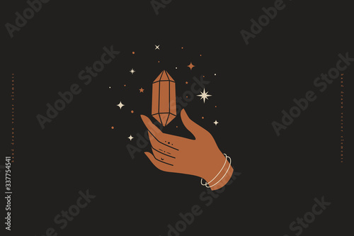 Magic crystal sparkles with stars and soars above hand. An occult symbol in trendy minimalist style on black background. Mystical quartz for spiritual practices of ethnic magic and astrological rites.