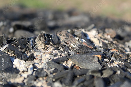 black coals and ashes from a street fire
