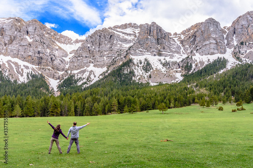 Mountain landscape with hikers having great time. (Cadi-Moixero Natural Park, Catalonia, Spain) photo