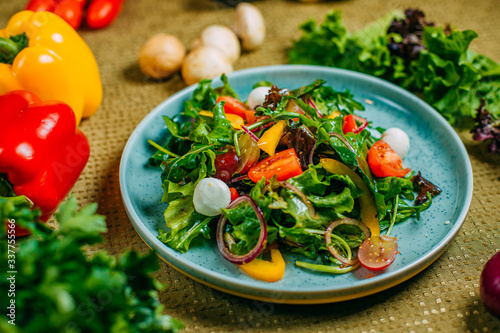 fresh vegetable salad, healthy food on a decorated table