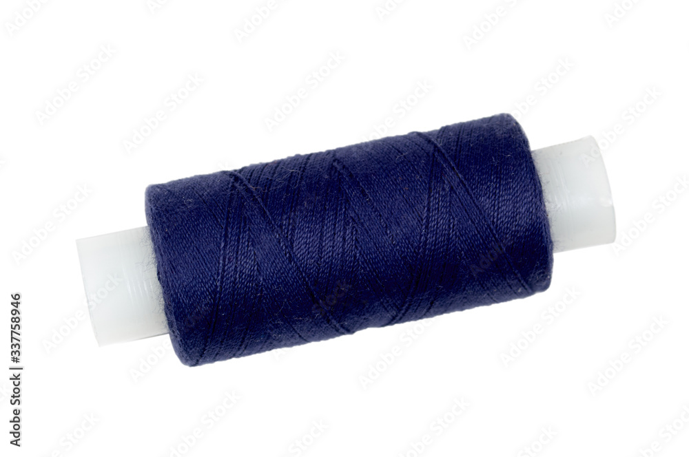 Close-Up Of Thread Spool Against White Background Close-Up Of Thread Spool Against White Background