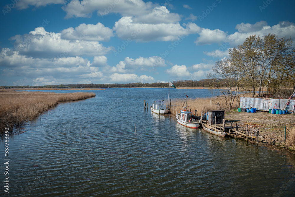 Fototapeta premium small fishing boats are moored on the banks of river