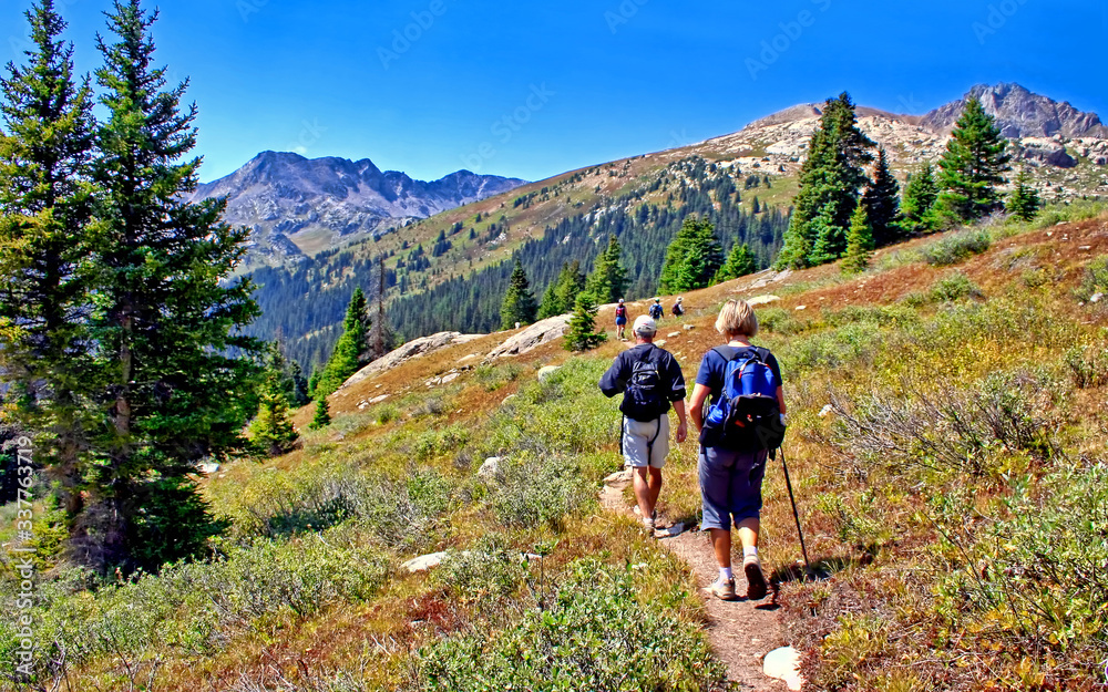 Middle-aged hikers on Colorado's Lost Man Trail in the Rocky Mountains near Aspen