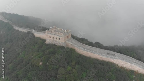 Amazing aerial pan shot above a tower of the Great Wall of China, at the Balding Natural Scenic Area in Beijing photo