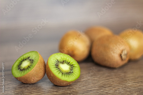 Still life with whole and sliced kiwi.