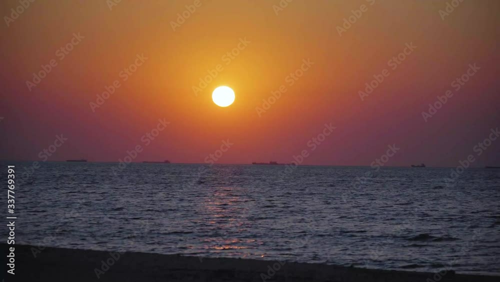Beautiful sunset on the beach. Orange sunrise at the sea. Beautiful landscape with the rising sun over the sea. 4k frames. Real time Russia, Sea of Azov. Pretty calm morning waves. Beautiful sunset on the beach. Orange sunrise at the sea. Beautiful landscape with the rising sun over the sea. 4k frames. Real time Russia, Sea of Azov. Pretty calm morning waves.