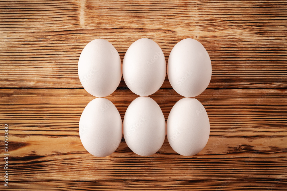 Eggs on a wooden background top view. Eggs on a wooden background top view.