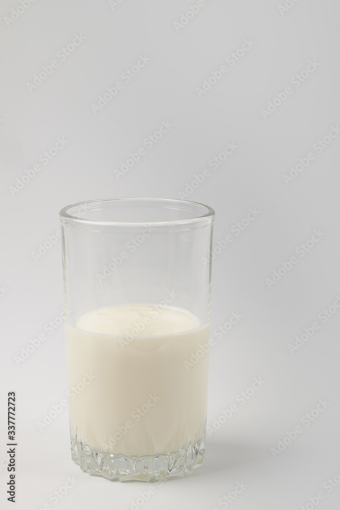 Kefir drink in a bottle and glass on a white background.Sour milk drink Kefir drink in a bottle and glass on a white background.Sour milk drink