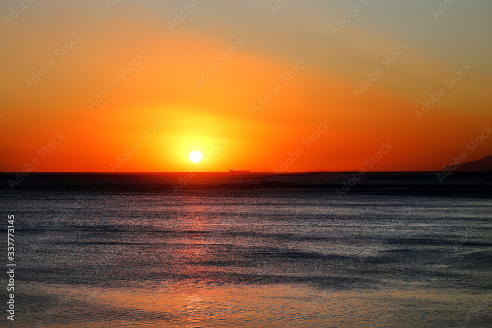 Beautiful photo of a bright sunset on the sea