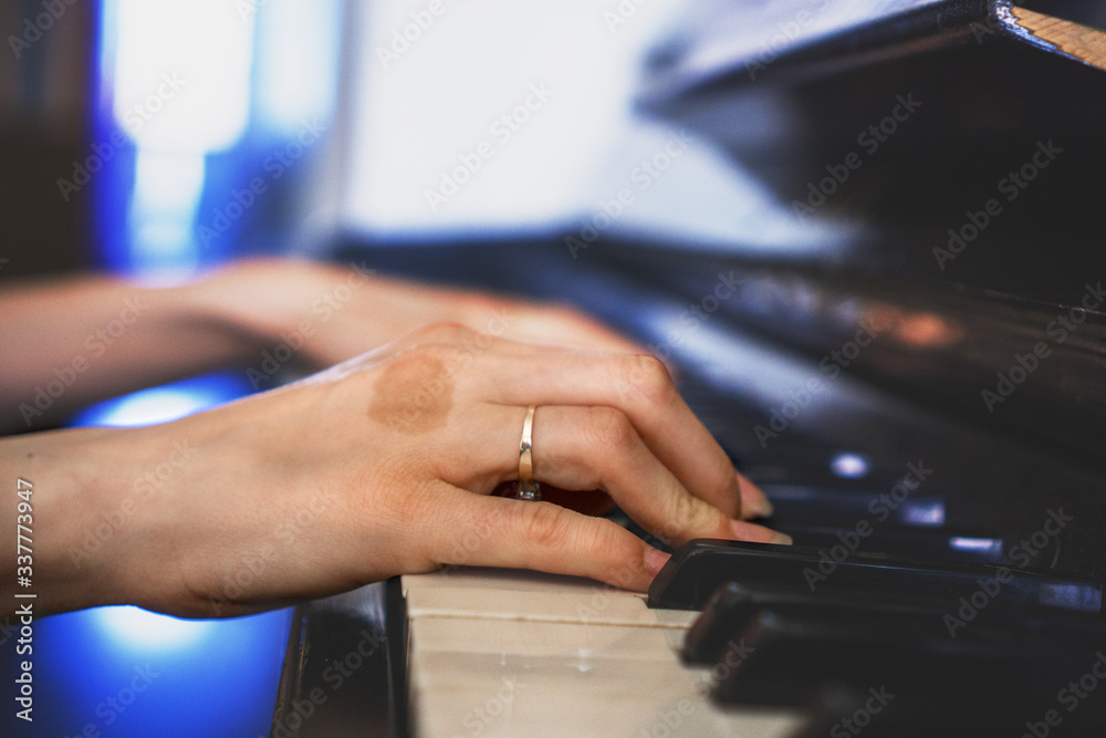 Girls hands on keyboard of piano. girl plays piano,close up piano. Hands on the white keys of the Piano Playing a Melody. Womens Hands on the keyboard, Playing the Notes Melody Girls hands on keyboard of piano. girl plays piano,close up piano. Hands on the white keys of the Piano Playing a Melody. Womens Hands on the keyboard, Playing the Notes Melody