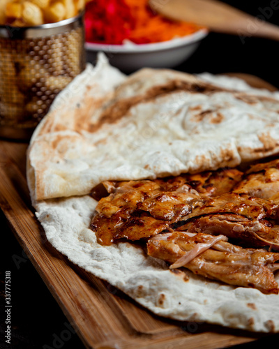 close up of chicken doner kebab with flatbread