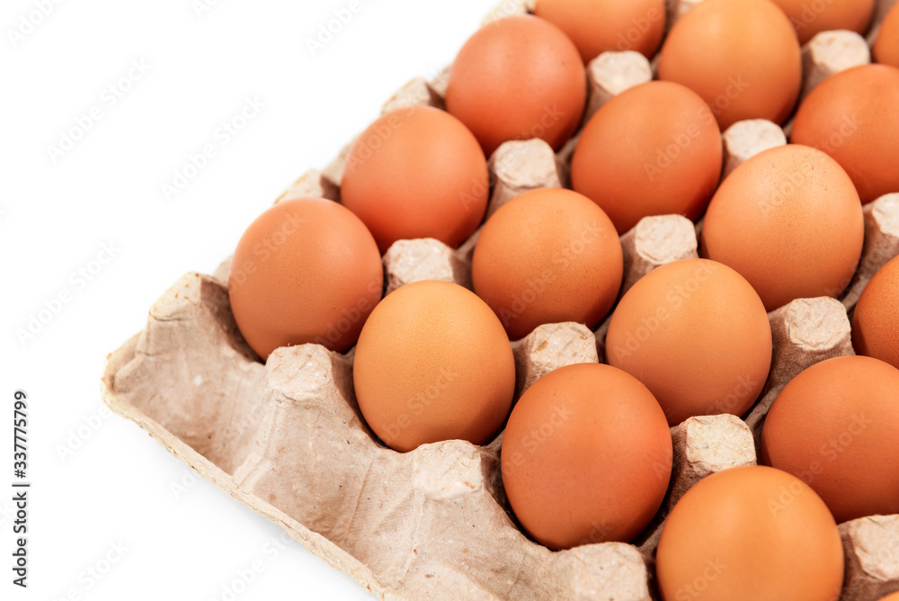 Chicken eggs on a white background in an organic box Chicken eggs on a white background in an organic box