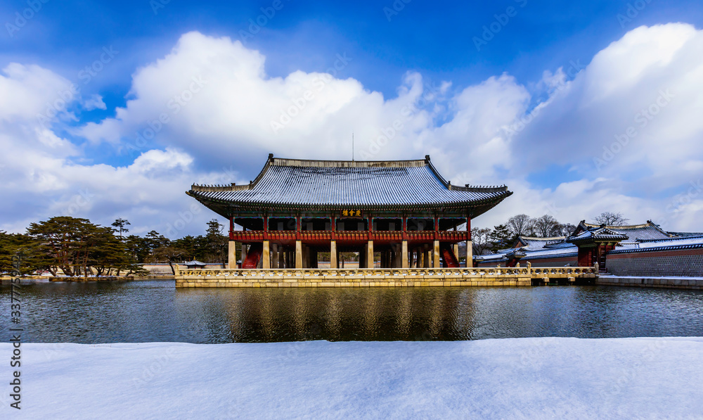 The after snow storm and Gyeonghoeru Pavilion at Gyeongbokgung Palace in Seoul, South Korea. Gyeonghoeru Pavilion on a sign... The after snow storm and Gyeonghoeru Pavilion at Gyeongbokgung Palace in Seoul, South Korea. Gyeonghoeru Pavilion on a sign...