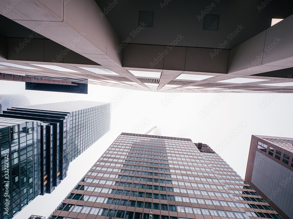 Fototapeta premium deep street canyons of frankfurt am main, germany on a cloudy day