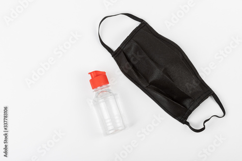 Medical mask and alcogel on a white background