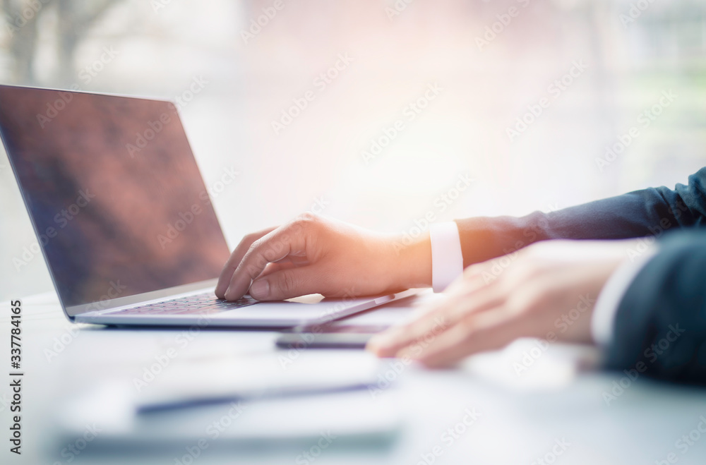 Business man hand typing on laptop computer keyboard. Business and technology concept Business man hand typing on laptop computer keyboard. Business and technology concept