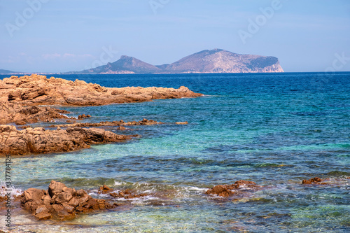 Marine Protected Area natural reserve with seashore rocks of Isola Tavolara island on Tyrrhenian Sea with Capo Figari cape, Monte Ruju peak and Golfo Aranchi gulf off northern coast of Sardinia, Italy photo