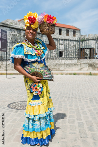 Portrait of Cuban lady in traditional colorful costume, Havana city