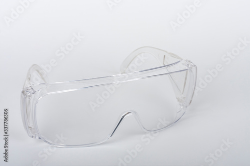 Plastic protective eyeglasses, personal protective equipment to protect against the virus covid-19.