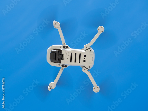 Dron Drone flying with action camera on nice blue sky background  remote control air drone