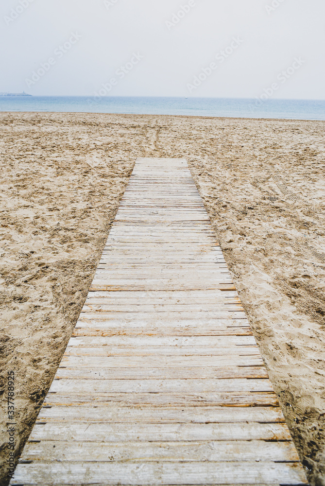 Obraz premium Wooden jetty on the beach. Wooden jetty on the beach.
