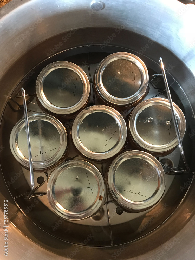 canning jars in stainless steel pressure cooker water bath Stock Photo Adobe Stock