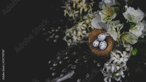 White floral mix on a black background. Alstroemeria, geocint and willow branches. Easter background.