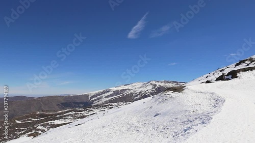 Sierra Nevada , Granada Spain panoramic landscape winter view. Mountains , snow, blue sky, sunny day