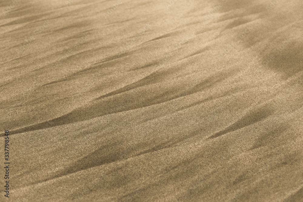closeup of sand pattern of a beach in the summer use for background closeup of sand pattern of a beach in the summer use for background