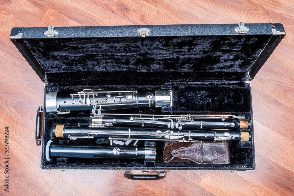 Old used bassoon parts unassembled in the case Old used bassoon parts unassembled in the case