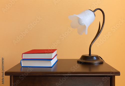 Two Books on a Wooden Nightstand