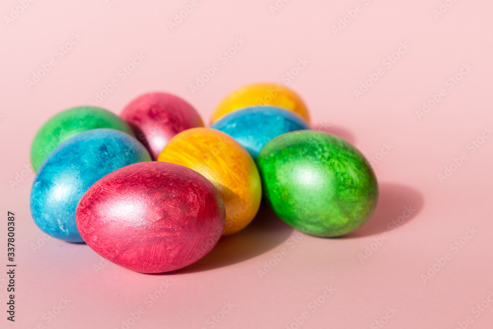 Colorful easter eggs on pink background. Happy Easter composition. Copy space. Colorful easter eggs on pink background. Happy Easter composition. Copy space.