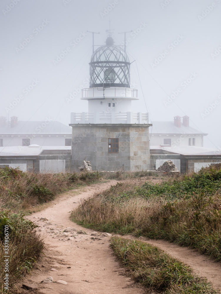 Punta Estaca de Bares Lighthouse on a foggy summer day, Galicia, Spain