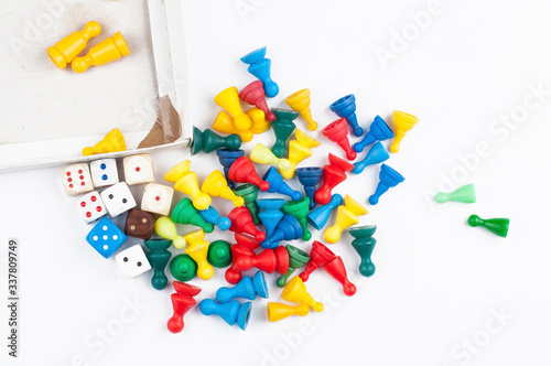 Colorful play figures with dice isolated on white background.Copy space