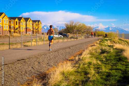 young man running on the Utah Lake