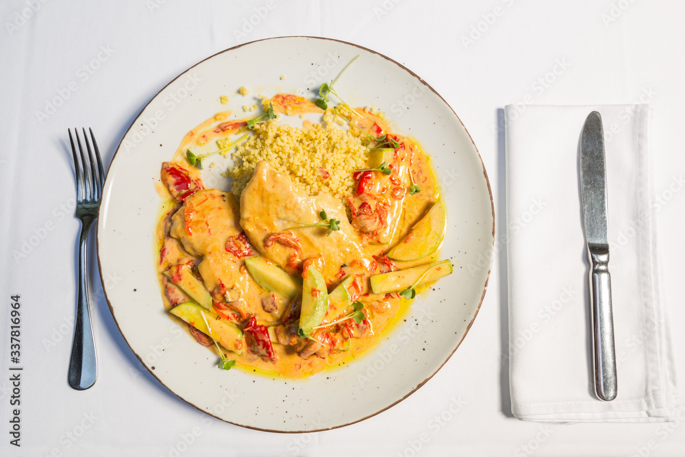 Chicken zucchini couscous served on a restaurant table Chicken zucchini couscous served on a restaurant table