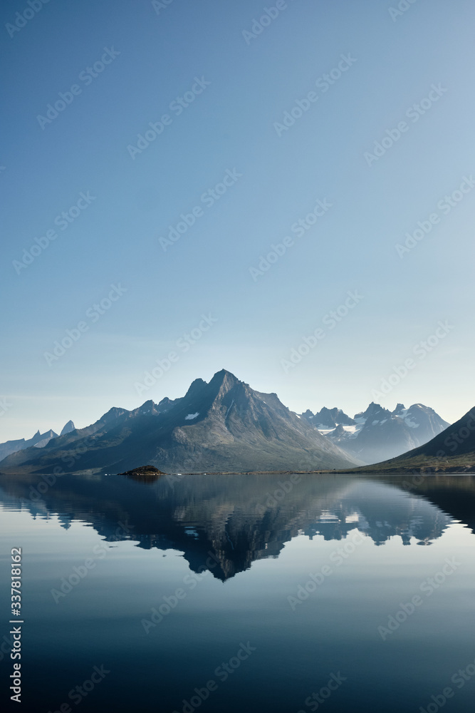 Mountains reflection in tasermiut fjord