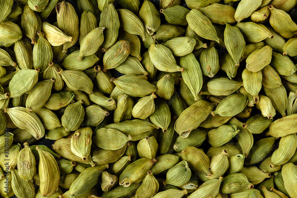 Top view macro closeup on plenty of green cardamom spice, horizontal format Top view macro closeup on plenty of green cardamom spice, horizontal format
