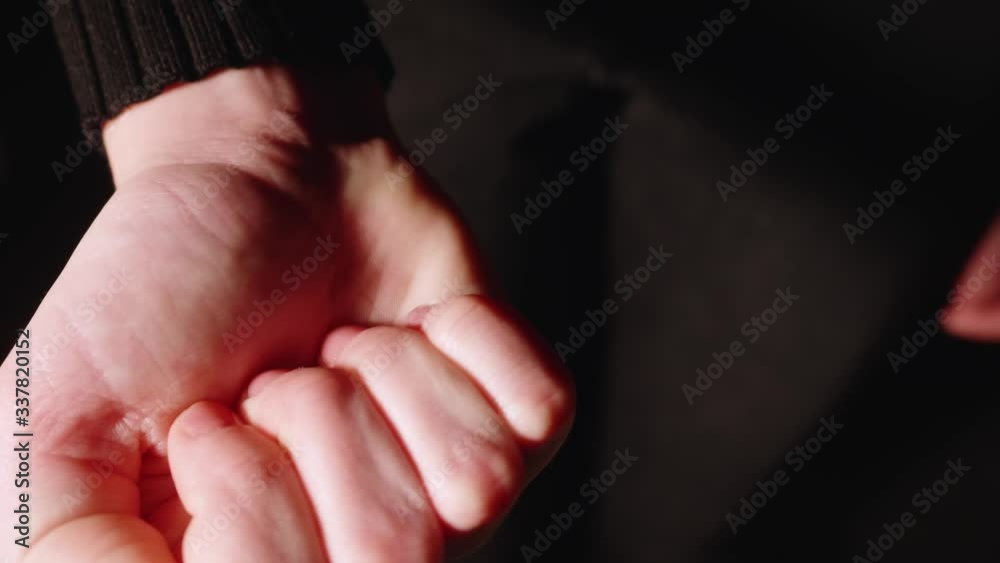 Girl opens fist and shows opened palm with pill Girl opens fist and shows opened palm with pill