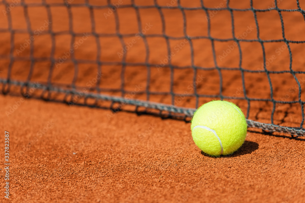 Close up of tennis ball on a middle of tennis court .Shallow doff